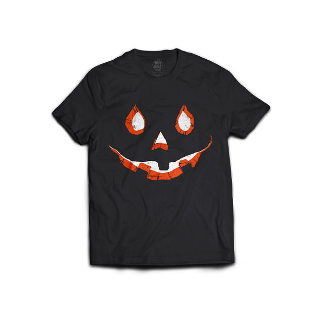 Black T-shirt, front view.  Orange and white carved jack o' lantern eyes nose and mouth.