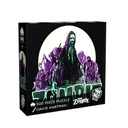 Puzzle box, front. Illustration, Full moon, black sky, purple zombies behind Rob Zombie Long dark hair pale green skin, red x on forehead, mustache and beard, wearing a black shirt bandages on arms. white outlined black lettering reads zombie.  White text at bottom reads 500 piece puzzle, David Hartman, Rob Zombie.  white trick or Treat Studios logo at bottom right.