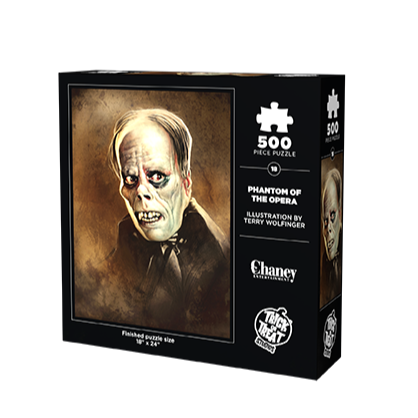 product box, back.  illustration of the phantom of the opera. Dark gray hair, pale wrinkled skin on face and neck, dark circles around eyes, snub nose, mouth grimacing, prominent dark gums and large yellowed teeth.  white text below reads finished puzzle size 18" x 24", text at right reads 500 piece puzzle, Phantom of the Opera, illustration by Terry Wolfinger, Chaney Entertainment .  white trick or Treat Studios logo bottom right 