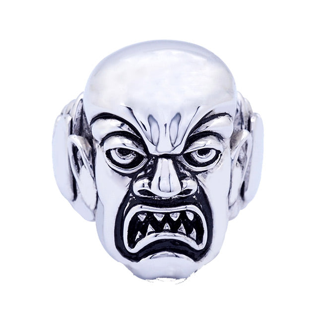Brass ring, silver plated, overhead front view.  Rob Zombie, Phantom Creep face, grimacing man with sharp teeth.