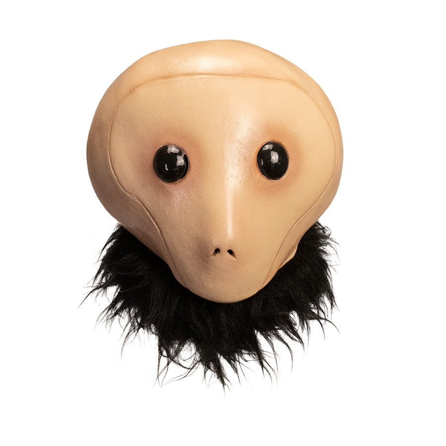 Mask, front view, head and neck.  Tan head large black eyes, small nostrils, no mouth.  Fur collar around neck.  