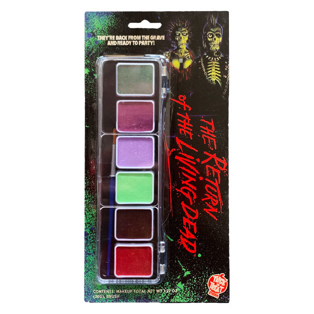 Product in packaging. Black and green background with illustrations of 2 zombies at top right.  White text at top reads They're back from the grave and ready to party! Makeup pallet with gray, mauve, lavender, light green, brown and red makeup pots and a blue handled art brush. Red text reads The Return of the Living Dead.  Orange and white Trick or Treat Studios logo at bottom right.