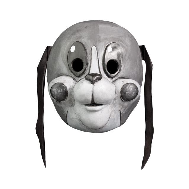 Mask, front view.  Grayscale, cartoonish dog face, long thin black ears hanging down, large tall oval eyes, small dark nose, white muzzle, gray circles on cheeks.