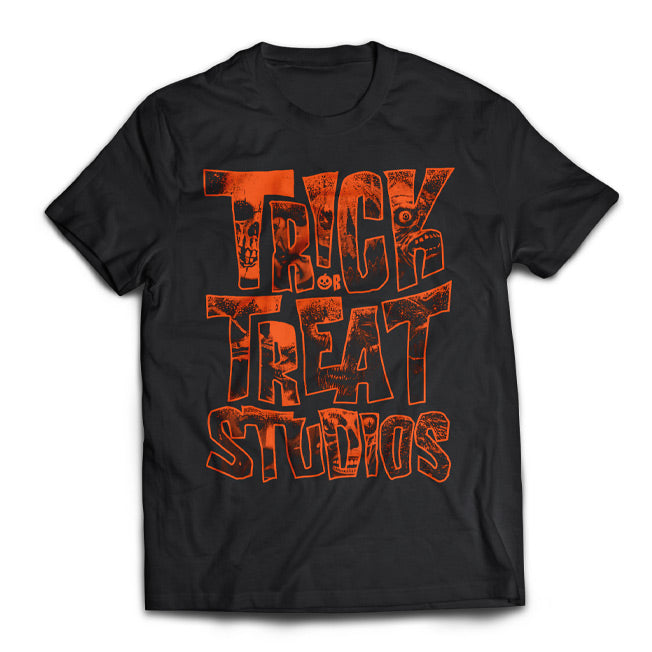 Black T-shirt, orange text reads Trick or Treat studios.