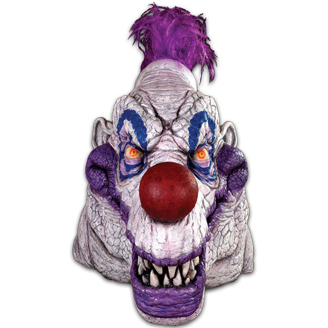 Mask.  Large, scary clown face, white wrinkled skin, purple tuft of hair in center top of head, orange ueyes outlined in blue circles, large red nose, big grinning mouth with purple lips and sharp teeth.
