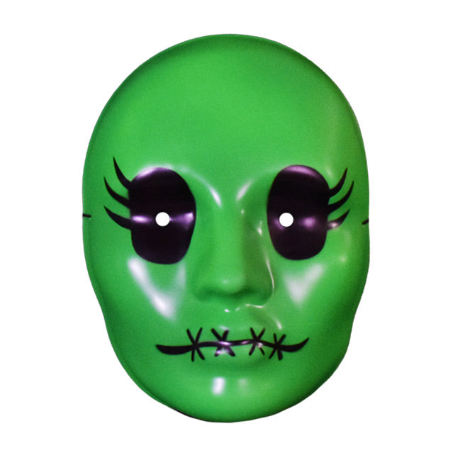 Vacuform plastic face mask, front view. Bright green face, large black eyes with 3 eyelashes on the sides, 4 black x stitches across lips.