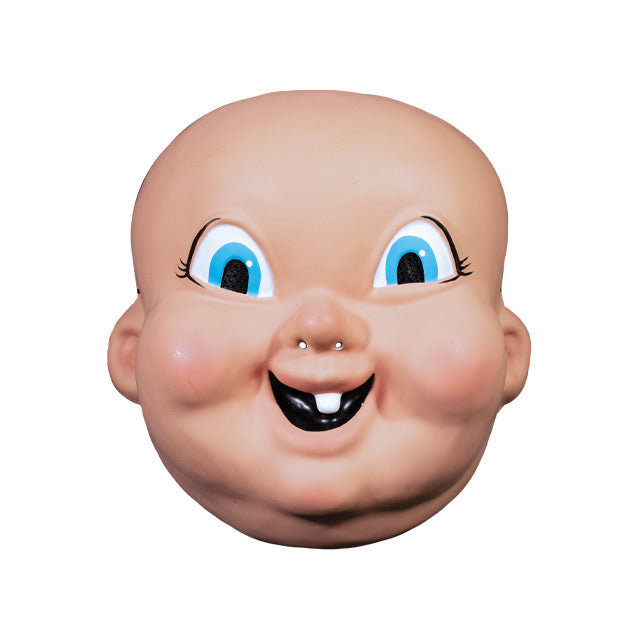 Plastic mask, front view. Bald, pink baby-like face, large cartoonish blue eyes, mouth smiling with one tooth.