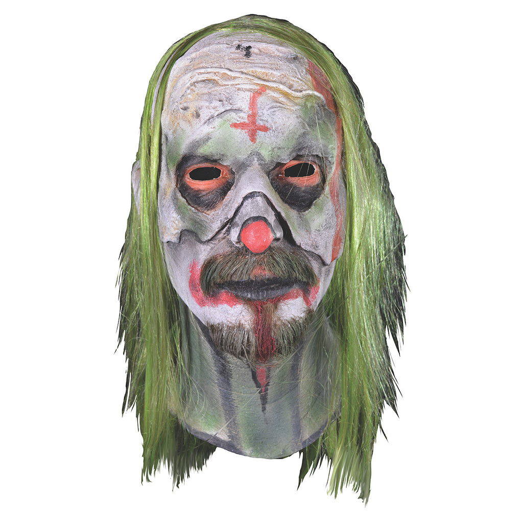 Mask, head and neck, front view.  Long, stringy greenish-blond hair.  white painted skin, pale red inverted cross on forehead, pale red around eyes surrounded by black circles. Pale red on tip of nose, around mouth down chin and onto neck.  moustache and goatee.