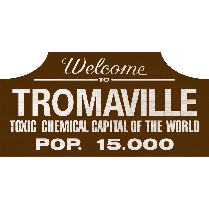 Wood sign.  Brown background.  White text reads Welcome to Tromaville Toxic Chemical Capital of the World pop 15000
