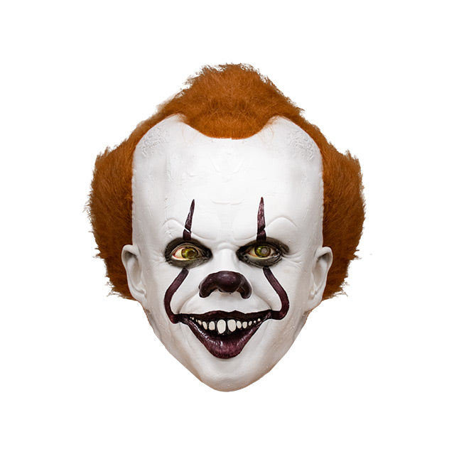 Mask, front view. IT clown face, red hair, white skin, large forehead, Dark red nose, dark lips, creepy smile with crooked buck teeth.