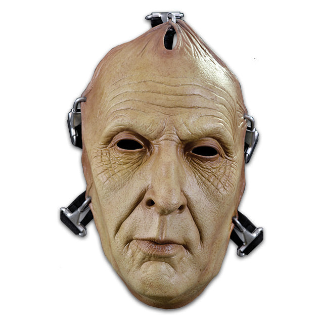 Mask. Mans face wrinkled skin, pulled tight with metal hooks.