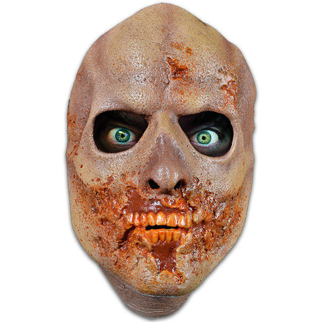 Face mask. Bald, discolored rotting flesh. Gory lower face, missing lips, showing stained orange teeth.