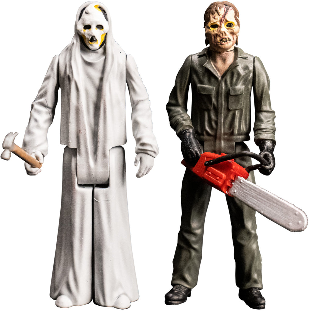 Two 3.75 inch figures, Ghost and Zombie. Ghost, White ghost face, black on sides of head and jaw. Black eyes and open moaning mouth. Yellow at tip of pointed head, around bottom of eyes and mouth and below cheeks. Zombie, Zombie face. Brown hair. Yellow rimmed black eyes. Large gash on forehead to bridge of pug nose. Misshapen mouth with pink lips and sparse yellow teeth. Wearing gray coveralls, holding chainsaw prop.