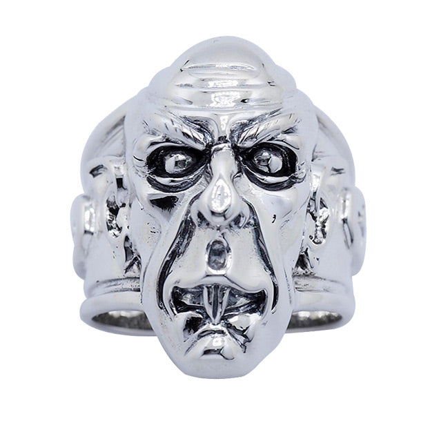 Brass ring, silver plated, front, overhead view.  Nosferatu vampire face.