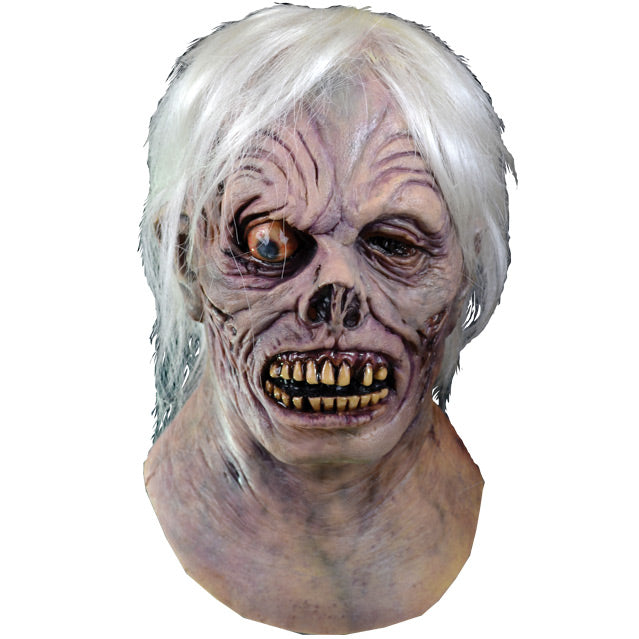 Mask, head and neck.  Front view.  White hair, wrinkled and rotting tan flesh. Bulging, bloodshot right eye.  Left eye and tip of nose missing.  Lips pulled back showing dark gums and yellowed teeth.