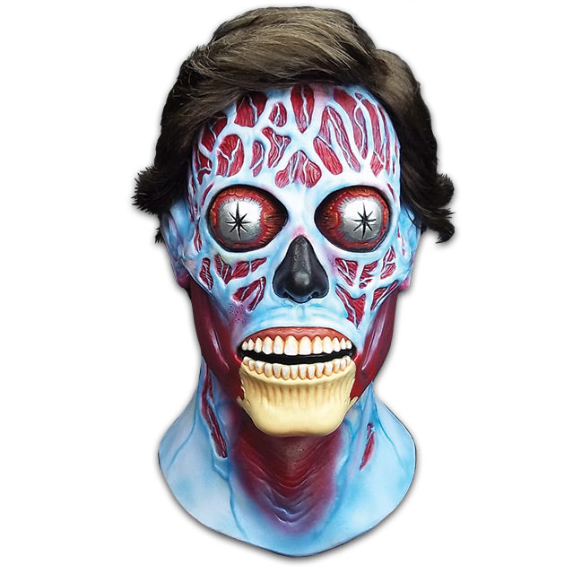 Mask, head and neck, front view. They Live Alien, Short brown hair, blue and red skull like face, silver bulging eyes, black nose, mouth slightly open, exposed teeth and bony chin.