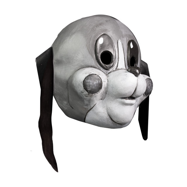 Mask, right view. Grayscale, cartoonish dog face, long thin black ears hanging down, large tall oval eyes, small dark nose, white muzzle, gray circles on cheeks.