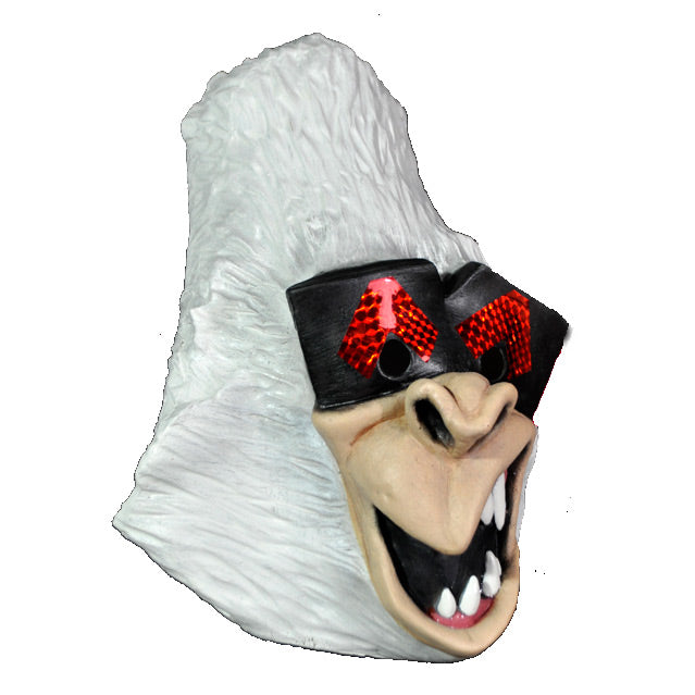 Mask, right side view. Cartoon style white gorilla face, black and red eye mask, gorilla nose and mouth, open showing sharp white teeth and pink gums.