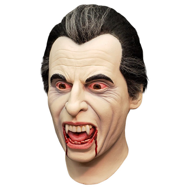 Mask, left side view, head and neck. Vampire, pale skin, black and gray hair, bloodshot eyes, vampire fangs, mouth open, blood dripping from both sides of mouth.