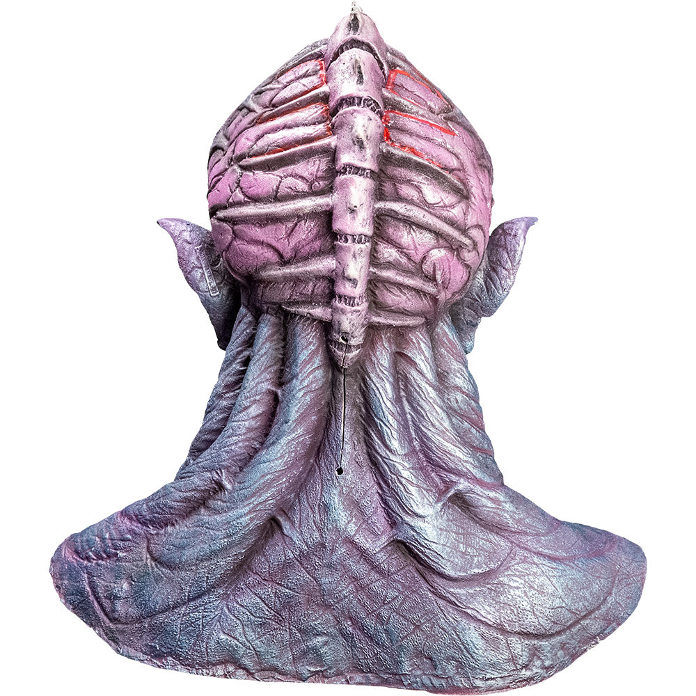 Mask, back view, head, neck and upper chest. Silvery gray skin with bulging veins, bald with spine like ridge on back of head, appearing over pink brain-like structure, pointed ears.