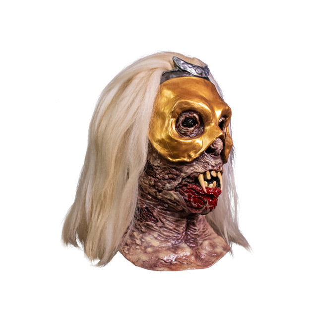 Mask, right side view, head and neck. White hair, wrinkled decaying skin, crooked teeth with fangs, blood coming from mouth, wearing a gold mask over the eyes with silver crescent moon at the top.