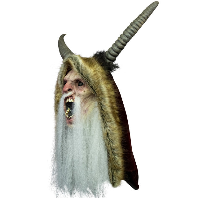 Mask, left side view. Krampus face, black eyes, wide open mouth, showing teeth, long white beard. Large horns on top of head, wearing light brown, fur hood