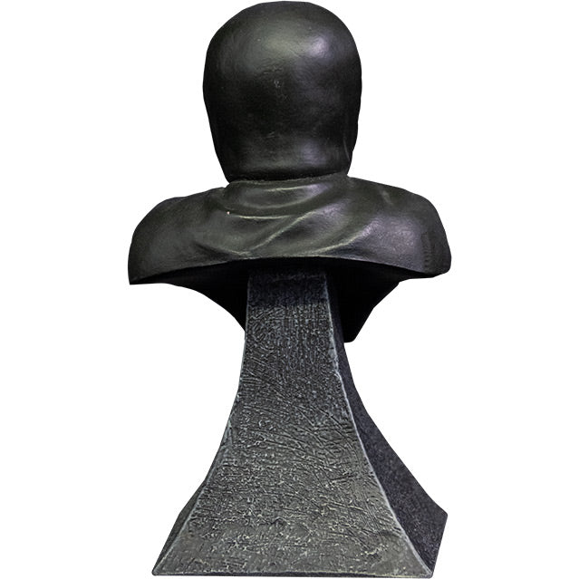 Mini bust, back view. Head and shoulders. Misfits Fiend,  wearing black hooded cloak. Set on gray stone textured base.