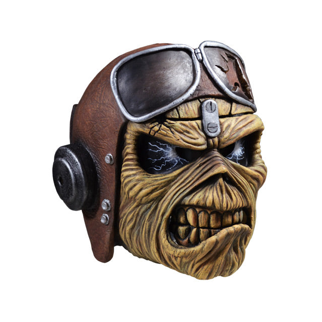 Mask, right side view. Iron Maiden Eddie, black eyes with lightening, wearing aviator helmet and headphones. Scowling mouth.