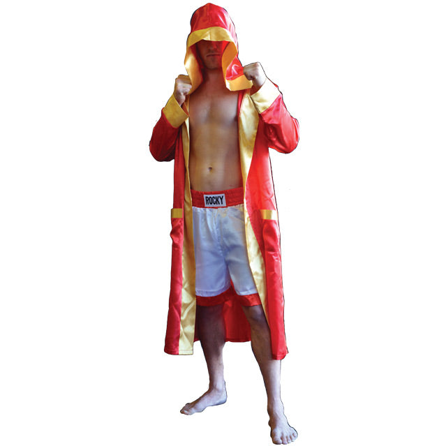 Front view, person wearing hooded red satin robe, gold trim and cuffs. over white and orange boxing trunks.