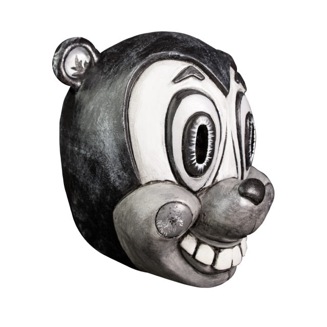 Mask, right view. Grayscale, cartoonish Bear face, black head, small round ears, large tall oval eyes, small dark nose, gray muzzle, large smile showing squared teeth, circles on cheeks.