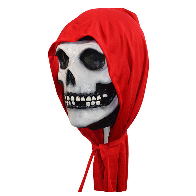 Mask, left view. Skull face, wearing red hood.