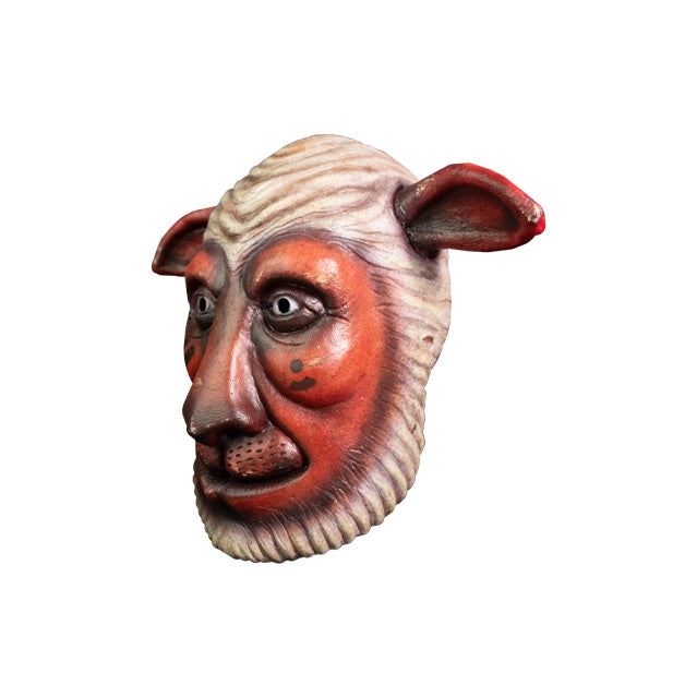 Mask, left view. Humanoid sheep face, brown ears and face, white wool textured on top of head, chin and sides of face.