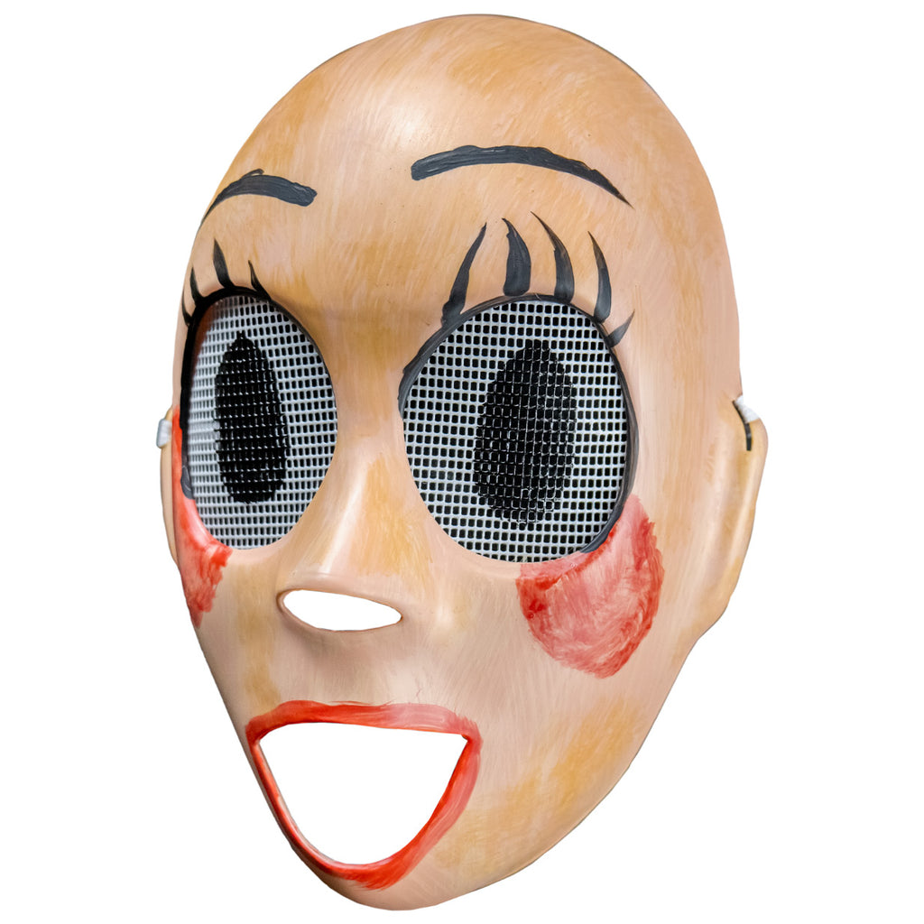Plastic face mask, left view. Pale tan, roughly painted nondescript face, holes for nose and mouth. Large black lined eyeholes covered in white screen, large black pupils painted on. painted on black eyelashes and eyebrows. Smeared red blush on cheeks, messy red lipstick around wide open mouth hole.