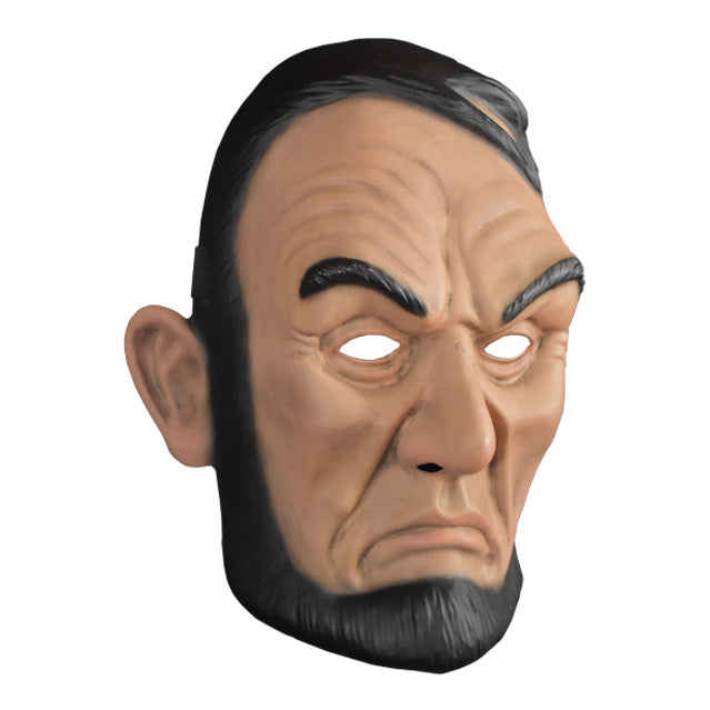 Plastic face mask. right view. Frowning Abraham Lincoln face. Black hair, black eyebrows, black beard and sideburns without a moustache, large ears.