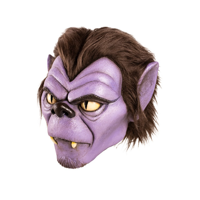 Mask left side view. Cartoon Wolfman face. Brown hair, purple skin, brown eyebrows and nose, pointed ears, fangs.