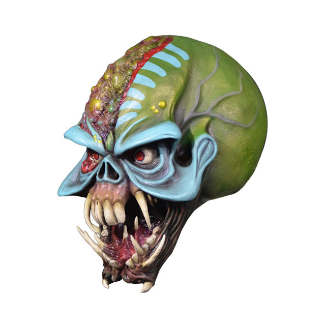Mask, left side view. Iron Maiden Eddie, red eyes, multi colored skull like face, Monstrous alien mouth.
