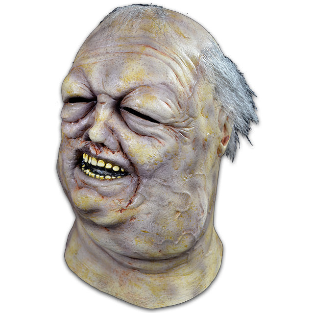 Mask, head and neck, left view. Blue and yellow discolored skin. Rotting and bloated waterlogged flesh. Salt and pepper hair. Eyes nearly swollen shut, deformed nose, mouth slightly open showing teeth.
