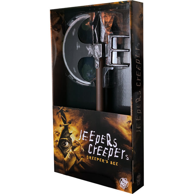 Product packaging, front.  Black and orange window box showing axe.  Text reads Jeepers Creepers, Creeper's axe. white Trick or Treat Studios logo.