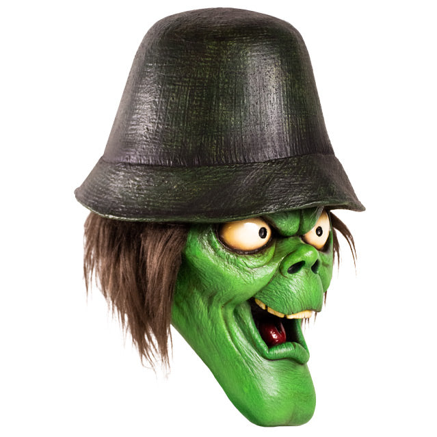 Mask, right side view. Green face with elongated chin, big white eyes, bushy brown hair, wearing a black hat.