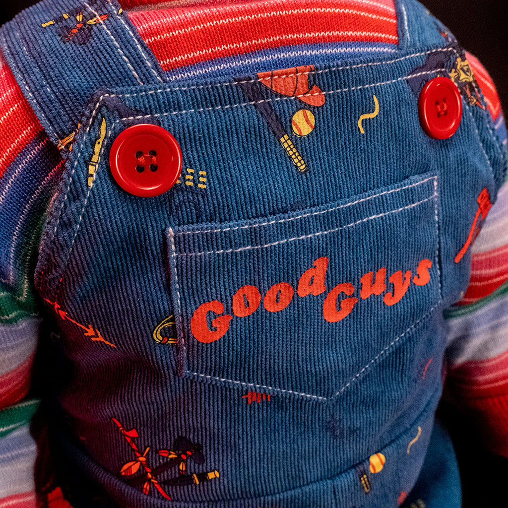 Close up detail of pocket on overalls, red text reads Good Guys