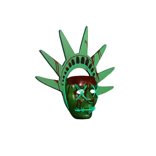 Plastic face mask. Right view. Green mask with nondescript facial features, bloodstains on forehead dripping down face and on green Lady Liberty headpiece. Light up strands of wire threaded around bottom edge of headband, across eyes in an x, in a semicircle under nose, and stitched across mouth.