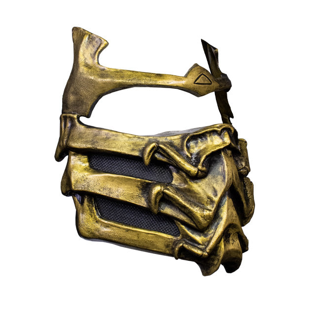 Plastic face mask, right side view. Gold and black, covers lower face and across brows.