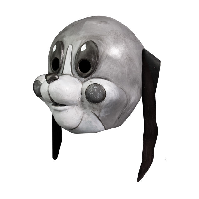 Mask, left view. Grayscale, cartoonish dog face, long thin black ears hanging down, large tall oval eyes, small dark nose, white muzzle, gray circles on cheeks.