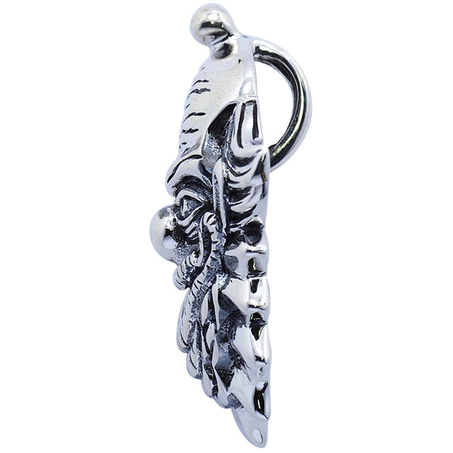 Sterling silver pendant, left side view. Creepy clown face with menacing grin, ruffled collar.