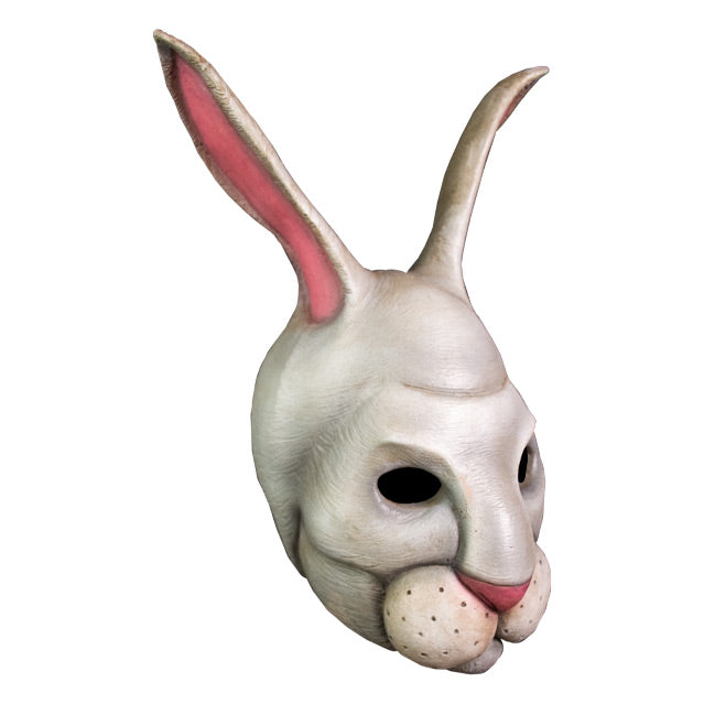 Mask. Right view. Gray-white rabbit face and upright ears. Pink nose and inside of ears. Full round rabbit upper lip, white with whisker spots.