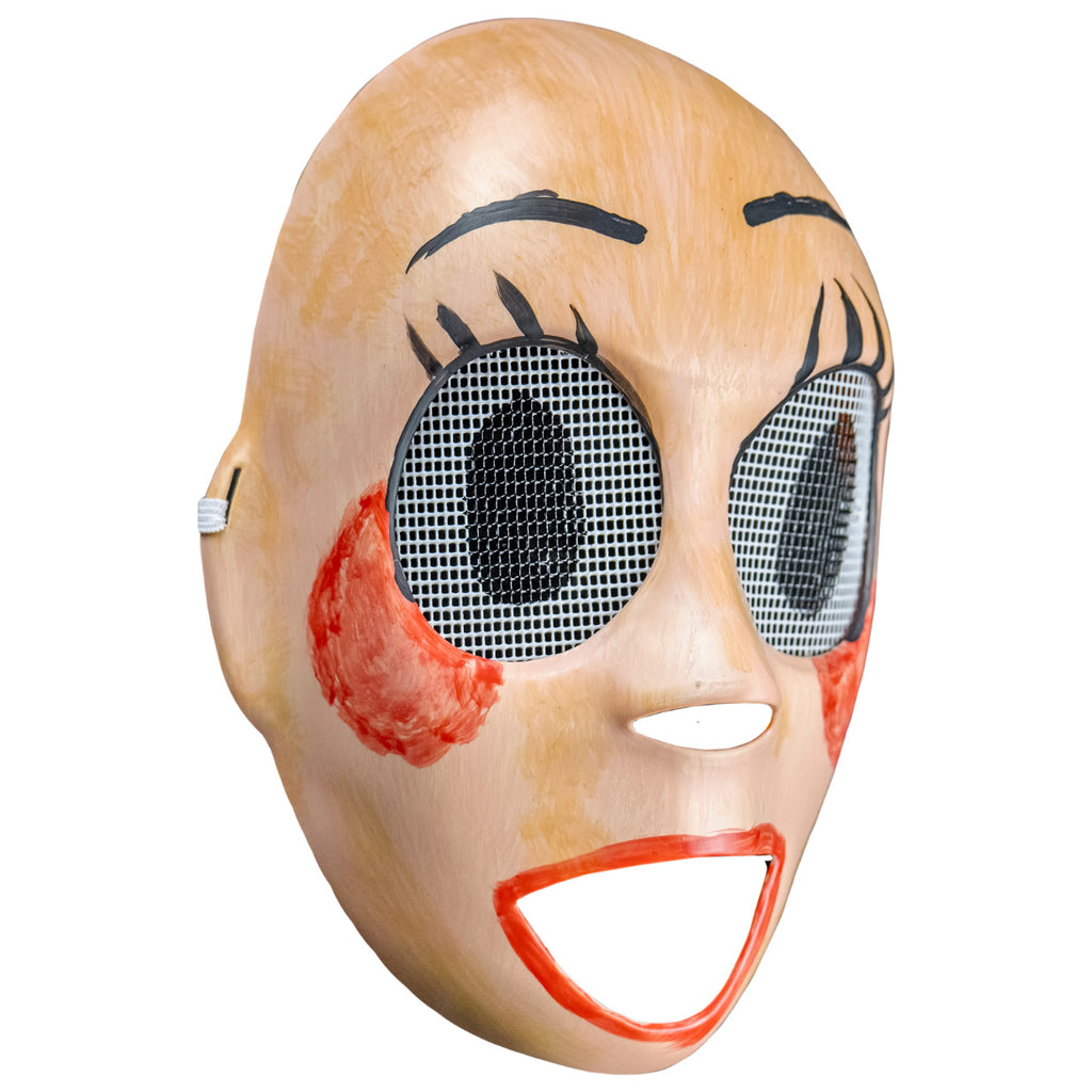 Plastic face mask, right view. Pale tan, roughly painted nondescript face, holes for nose and mouth. Large black lined eyeholes covered in white screen, large black pupils painted on. painted on black eyelashes and eyebrows. Smeared red blush on cheeks, messy red lipstick around wide open mouth hole.
