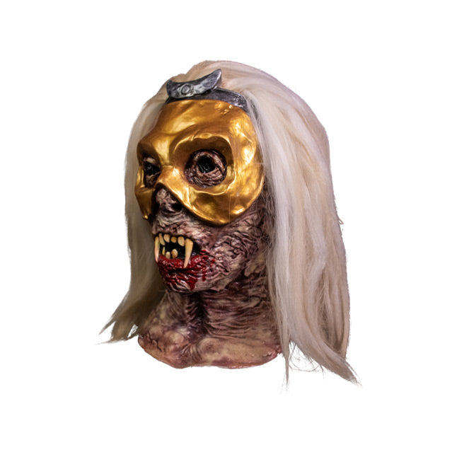 Mask, left side view, head and neck. White hair, wrinkled decaying skin, crooked teeth with fangs, blood coming from mouth, wearing a gold mask over the eyes with silver crescent moon at the top.