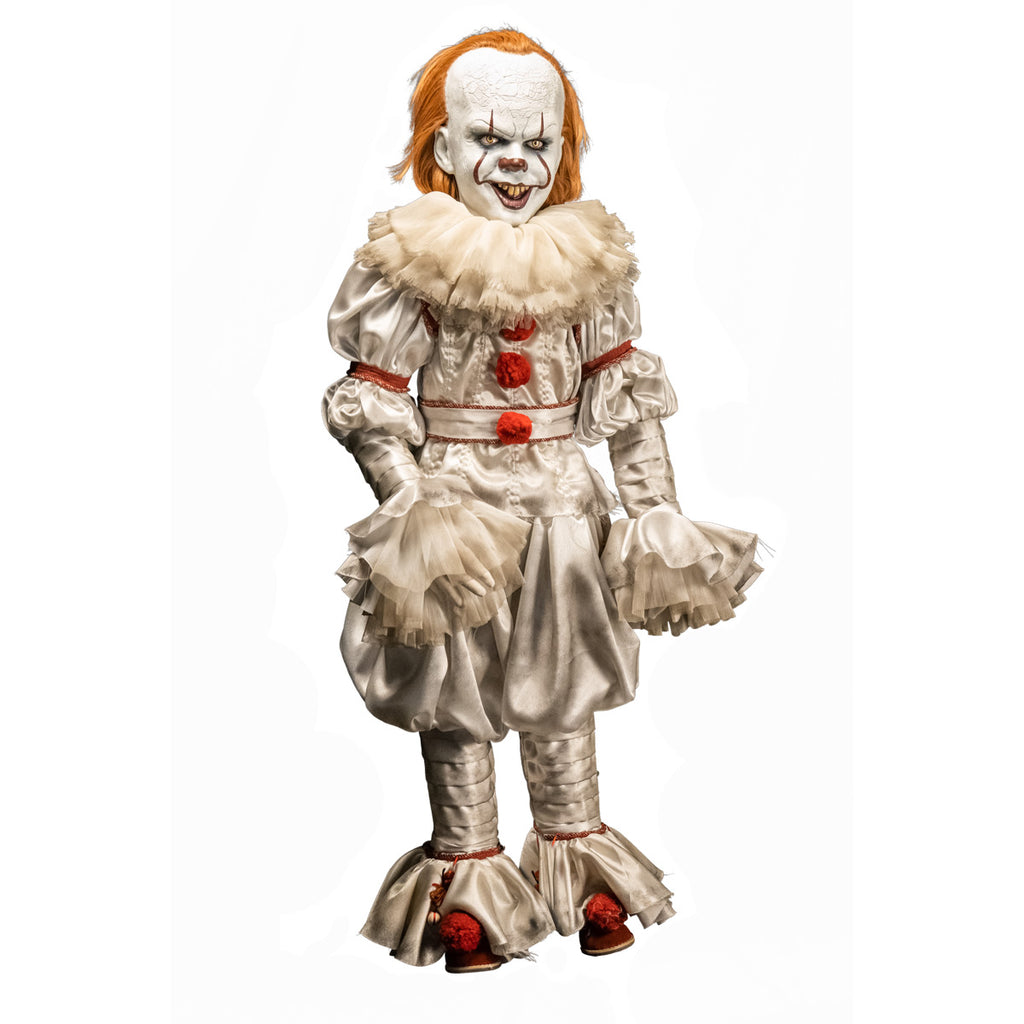 Pennywise doll, slight right view. clown face, red hair, white skin, large forehead, yellow eyes and nose, dark lips, creepy smile with crooked buck teeth. wearing white and red clown outfit with ruffles at collar and cuffs, red shoes.