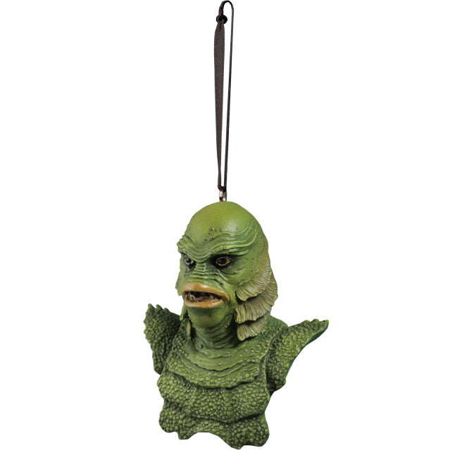 Ornament, left side view. Bust, head shoulders and upper chest of green scaly fish-man