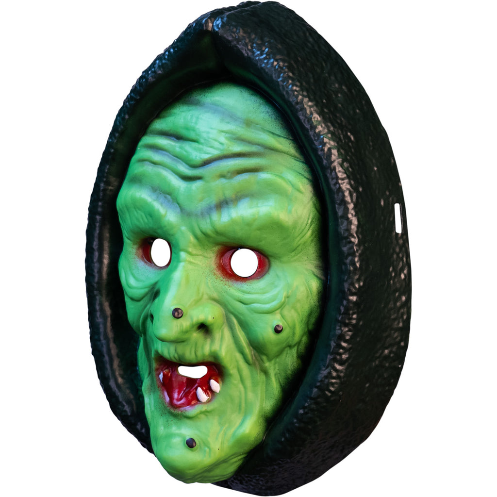 Left side view, plastic witch face mask. Green face with warts, red mouth, black hood.